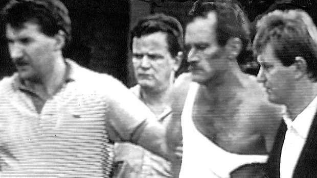 Russell "Mad Dog" Cox, second from right, following his capture at Melbourne's Doncaster shopping centre in 1988.  