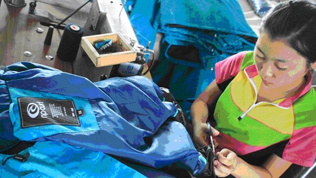 Workers cutting fabric for Rip Curl jackets in a factory about 100 kilometres south of Pyongyang in North Korea.