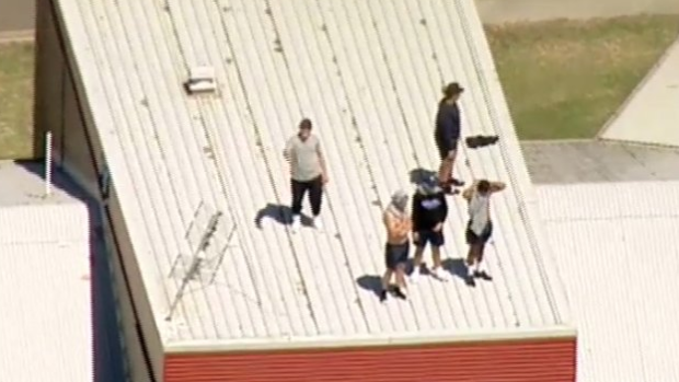 Youths on the roof of the Malmsbury Justice Centre.