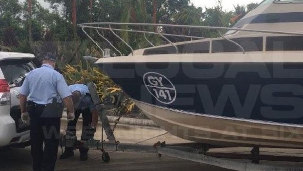 The boat police say the men were planning to use to cross over to Indonesia. 