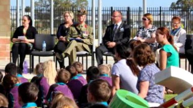 Barry Urban on Anzac Day wearing the fake medal at a school assembly.