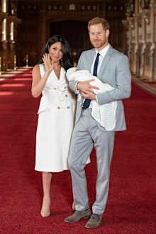 Prince Harry and Meghan, Duchess of Sussex, during a photocall with their newborn son, in St George's Hall at Windsor Castle.