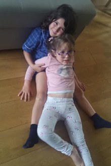 Big sister Erica, eight, with Arianna, five.