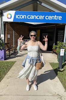 Becky Sinclair poses outside the Icon Cancer Centre in Townsville.