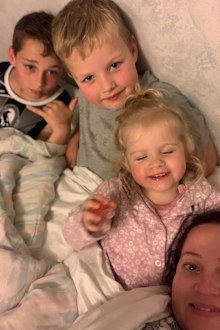 Willow with her brothers and mum before her cancer treatment.