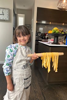 Gabriella Guise, pictured making pasta during a COVID-19 lockdown, was delighted when she found out there was no school.