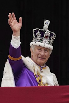 King Charles III waves from the balcony of Buckingham Palace, London, after the coronation ceremony of King Charles III and Queen Camilla, Saturday, May 6, 2023.