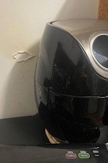 an air fryer has caused heat damage to the wall behind it