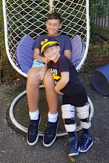 Special bond between 12-year-old cancer survivor and his sick baby brother