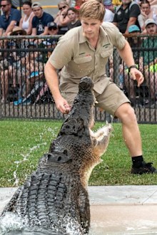 Robert Irwin feeding a crocodile at Australia Zoo