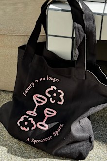 A Pretty Privilege Club tote bag.