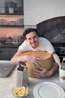 Brooklyn Peltz Beckham hugs a wheel of cheese