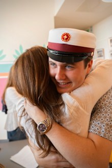 Crown Prince Christian hugs mum Queen Mary at high school graduation.