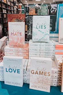 Books from Ana Huang's Twisted Love series on display.