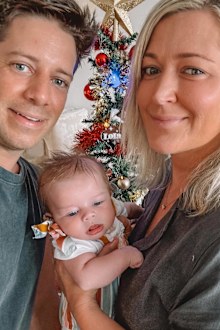 Kellie Johnson with her partner and daughter Lola.