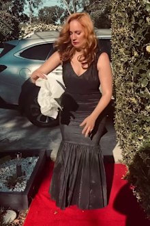 Jules Robinson picking nappy from her dress. 