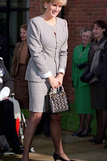 BIRMINGHAM, UNITED KINGDOM - OCTOBER 31 1995:  Princess Diana, Patron, Opening The National Institute Of Conductive Education At Cannon Hill House, Russell Road, Moseley, Birmingham.  The Princess Is Wearing A Black And White Houndstooth Check Suit And She Is Carrying A Christian Dior Black Handbag.  (Photo by Tim Graham Photo Library via Getty Images)