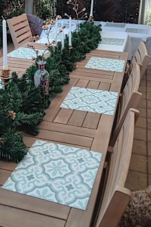 Kmart vinyl tiles used as placemats for a Christmas table setting.