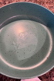 Plastic bowl with adhesive left behind from sticky label removal