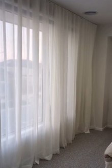 Shannyn shows how she installed Kmart's Sicily S-fold curtains