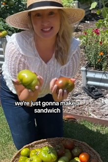 Gardener Sarah Rani with tomatoes she's grown at home.