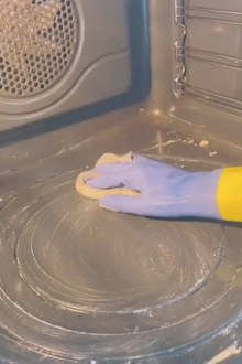 Woman shares TikTok hack for cleaning oven while you sleep.