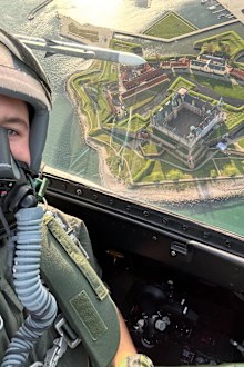 Crown Prince Christian of Denmark on board a training flight with F-16 aircraft on October 13, 2025, at Fighter Wing Skrydstrup, with Kronborg Castle in the background.