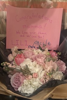 Flowers and a card from Prince Harry, Prince Archie and Princess Lilibet congratulating Meghan on the launch of With Love, Meghan.