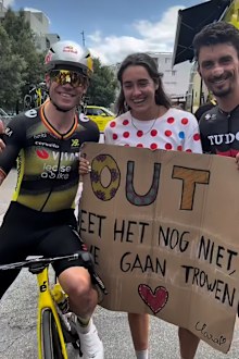 Wout Van Aert and Julian Alaphilippe pose with the fan whose sign Alaphilippe stole during stage 14. 