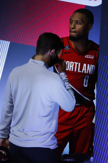 Damian Lillard of the Portland Trail Blazers is tended to after hurting his finger.