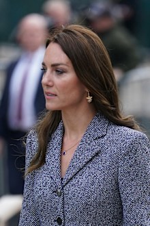 Kate, Duchess of Cambridge wears a bee earring design, which is a symbol of Manchester, as she arrives with her husband Prince William to attend the launch of the Glade of Light Memorial, outside Manchester Cathedral, which commemorates the victims of a suicide bomb attack at a 2017 Ariana Grande concert, in Manchester, England, Tuesday, May 10, 2022.  
