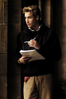 Britain's Prince William pauses in St Salvator's Quad at St Andrews University where he is a student in St Andrews Scotland Monday Nov. 15, 2004. 
