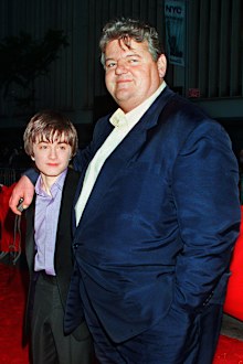 Daniel Radcliffe, left, who plays Harry Potter in the new movie "Harry Potter and the Sorcerer's Stone," and Robbie Coltrane, who plays Hagrid in the film, arrive for the film's New York premiere on Nov. 11, 2001. 