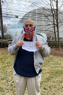 Nick carried a sign reading "I love you, sweetheart," to show his wife Marion.