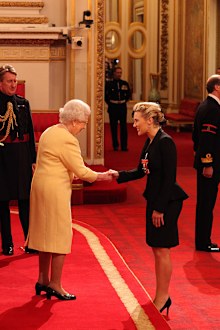 Actress Kate Winslet is awarded a CBE, for services to drama by Queen Elizabeth II during an Investiture ceremony at Buckingham Palace in central London. Date taken: 21-Nov-2012