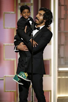 74th ANNUAL GOLDEN GLOBE AWARDS -- Pictured: Sunny Pawar, Dev Patel, Presenters, at the 74th Annual Golden Globe Awards held at the Beverly Hilton Hotel on January 8, 2017 -- (Photo by: Paul Drinkwater/NBC)