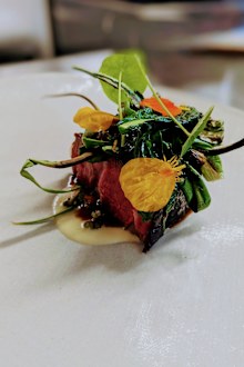 Beef from the Burren, barbeque brassicas, new season garlic and spring onion — a dish on the Homestead Cottage menu.  **This image is for use with this specific article only** 