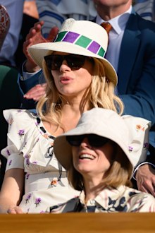 Sienna Miller and Jodie Foster react to the action court-side on day nine of the Wimbledon Tennis Championships at the All England Lawn Tennis and Croquet Club  on July 8, 2025 in London, England.