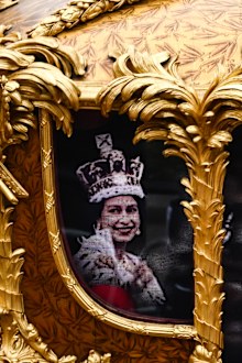 A hologram of Queen Elizabeth II during her coronation is projected in the Gold State Coach as it passes in front of Buckingham Palace during the Platinum Jubilee Pageant in front of Buckingham Palace, on day four of the Platinum Jubilee celebrations on June 05, 2022 in London, England. 