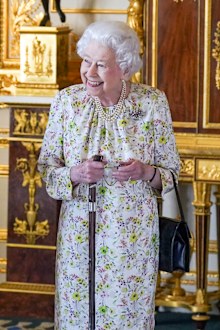 WINDSOR, ENGLAND - MARCH 23: Queen Elizabeth II arrives to view a display of artefacts from British craftwork company, Halcyon Days, to commemorate the company's 70th anniversary in the White Drawing Room at Windsor Castle, on March 23, 2022 in Windsor, England. The Queen viewed a selection of hand-decorated archive enamelware and fine bone china, including their earliest designs from the 1950s. (Photo Steve Parsons - WPA Pool/Getty Images)