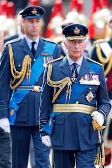 Prince William, Prince of Wales and King Charles III walk behind Queen Elizabeth II's coffin ahead of her Lying-in-State on September 14, 2022 in London, United Kingdom. 