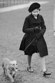 FILE - Princess Elizabeth takes her pet dog for a walk in Hyde Park, London, on Feb. 26. 1936. It's widely known that Elizabeth loved corgi dogs, Princess Diana reportedly called the animals the queen's "moving carpet" because they accompanied her everywhere.  (AP Photo, File)