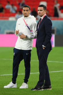 Tim Cahill, Australia's Head of Delegation, inspects the pitch with Keanu Baccus at Ahmad Bin Ali Stadium in Qatar. (Photo by David Ramos - FIFA/FIFA via Getty Images)