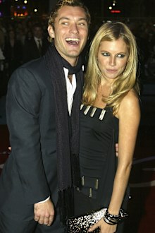 Actors Jude Law and Sienna Miller arrive at the World Premiere of Alfie at the Empire Leicester Square on October 14, 2004 in London. 