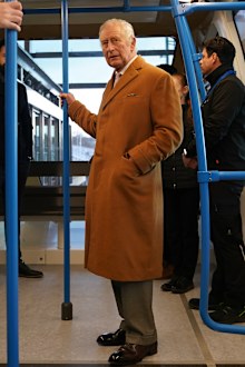 King Charles III travels in a DART carriage for the three-minute journey to the Luton DART central terminal, during a visit to Luton DART Parkway Station