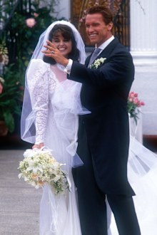 Actor Arnold Schwarzenegger with his new wife Maria Shriver outside St. Francis Xavier Church after their wedding on April 26, 1986 in Hyannis, Massachusetts.