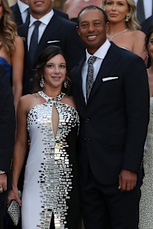 Tiger Woods of the United States poses with girlfriend Erica Herman before the Ryder Cup gala dinner.