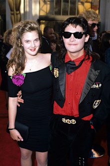 Drew Barrymore and Corey Feldman attend the 1989 Oscars at the Shrine Auditorium in Los Angeles, California.