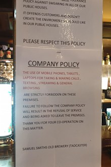 Pub bans swearing and use of mobile phones in strongly-worded 'company policy'.