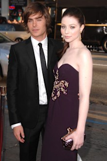 Zac Efron and Michelle Trachtenberg arrive at the Los Angeles premiere of 17 Again in 2009.
